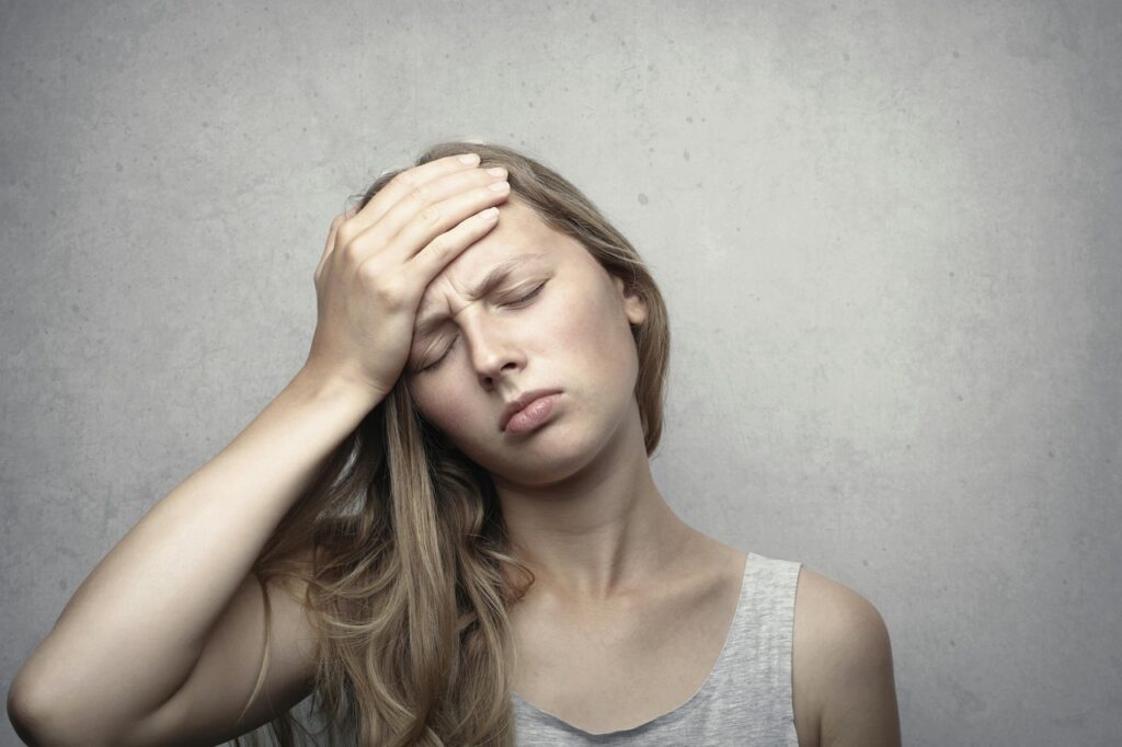 Woman suffering from Migraines