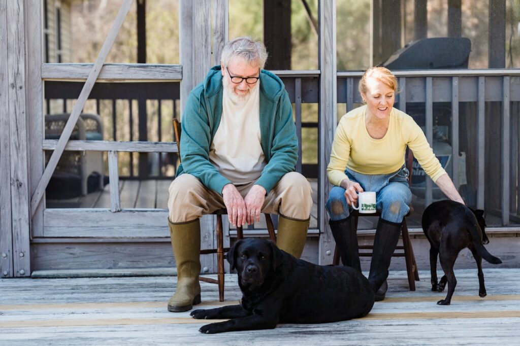 A black Labrador with its owners
