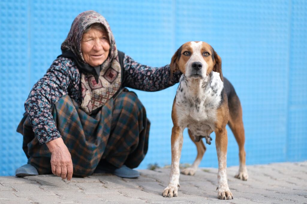 An old woman with her old dog