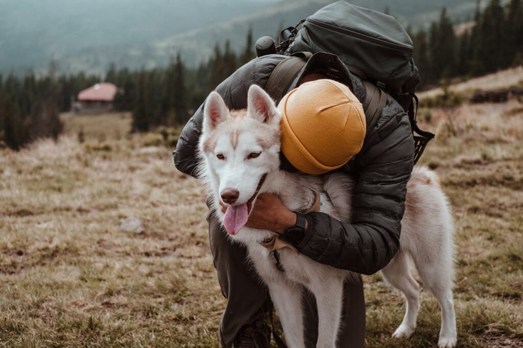 A Huskey with its owner