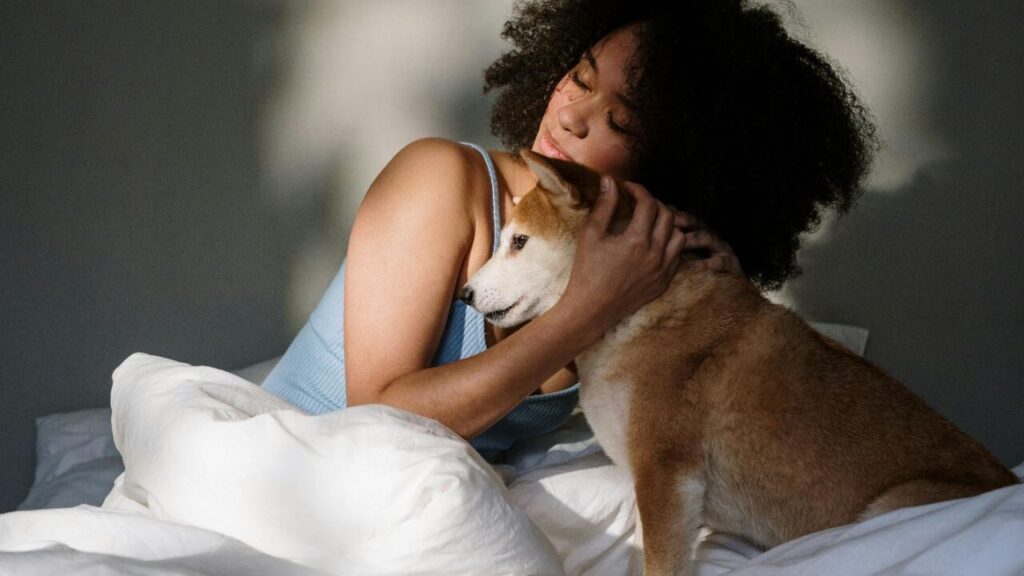 A woman hugging a dog