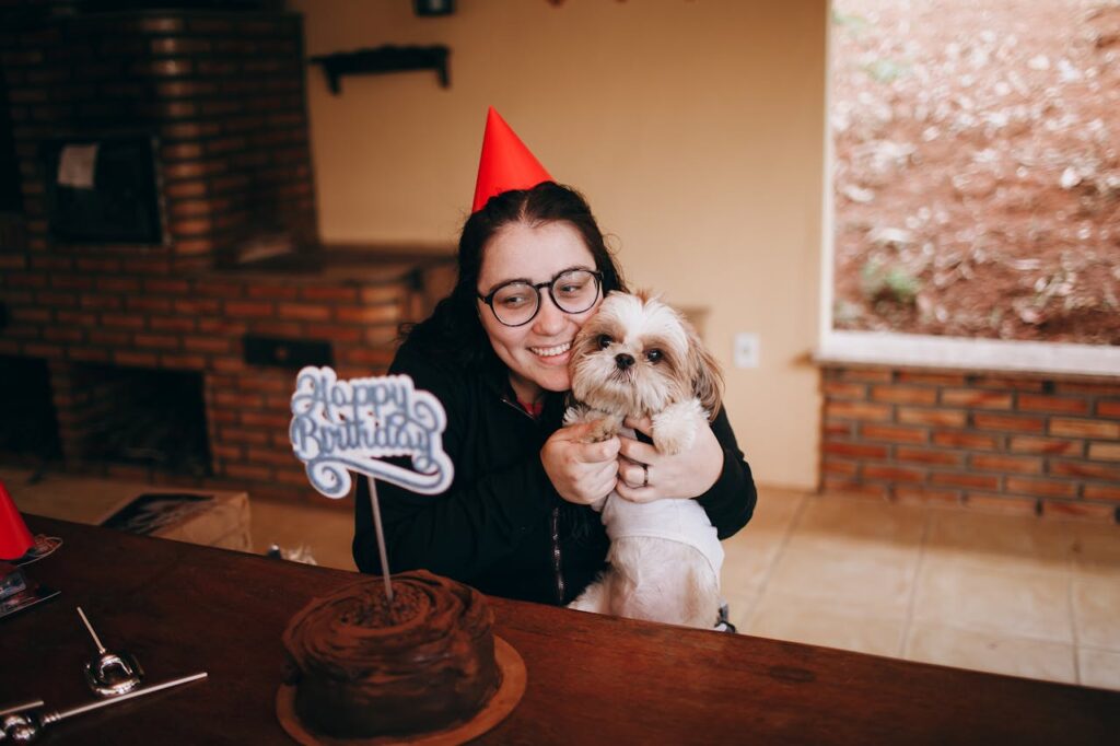 Middle aged woman celebrating dogs birthday