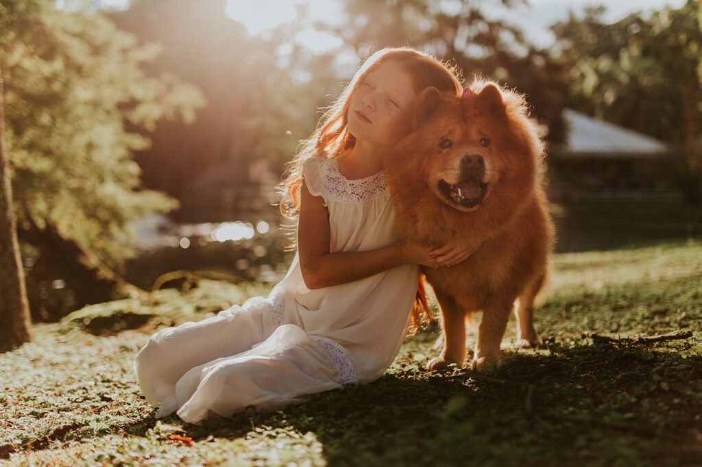 Girl hugging a fluffy Chow Chow