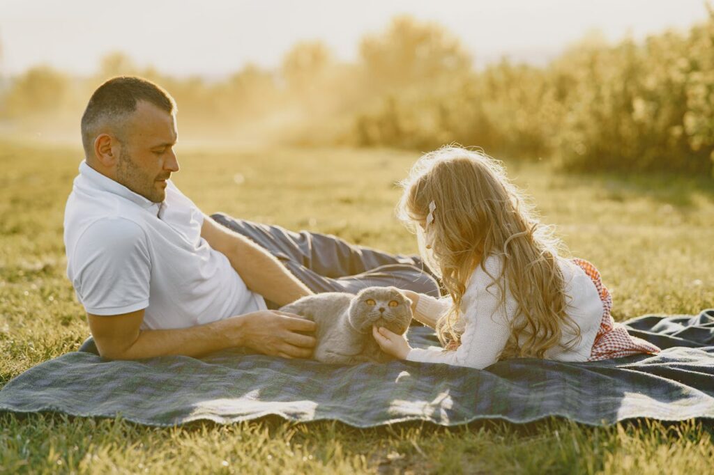 a-father-and-daughter-with-their-scottish-fold-cat-