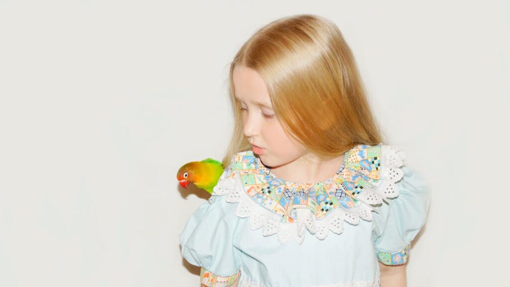 kid with parrot