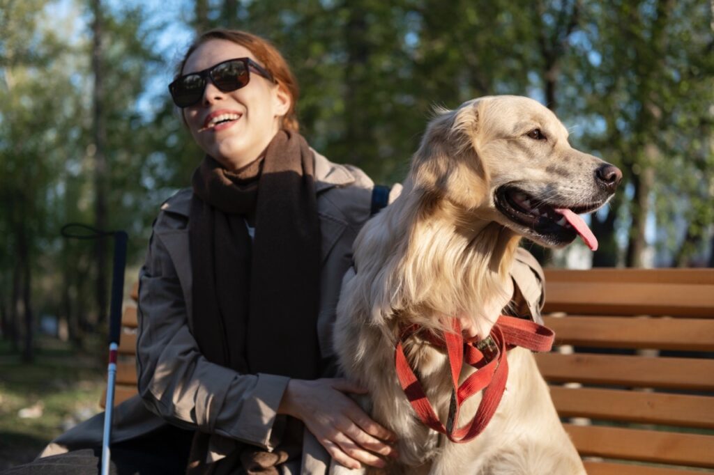Golden Retriever with blind woman