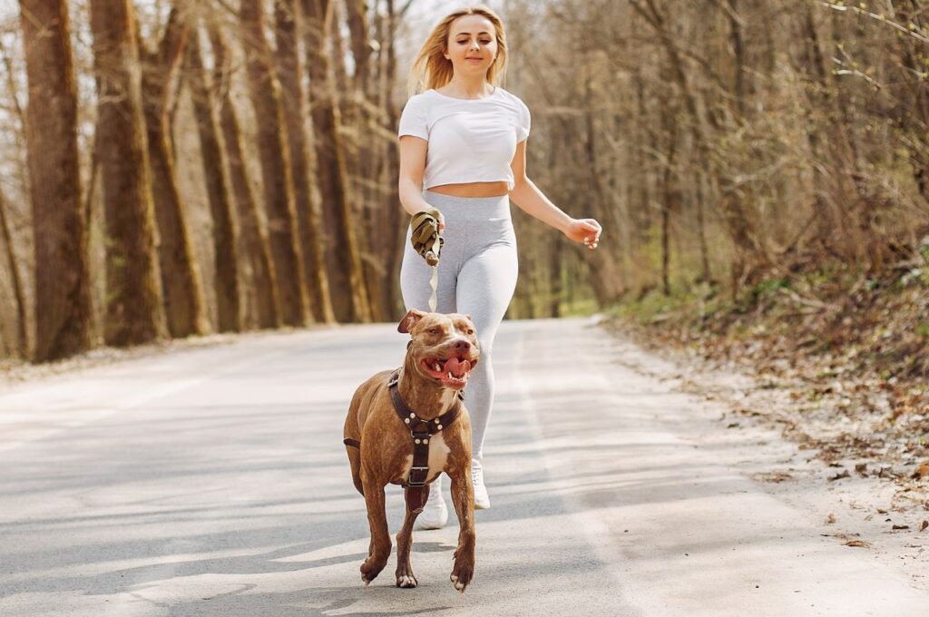 Woman running with a dog