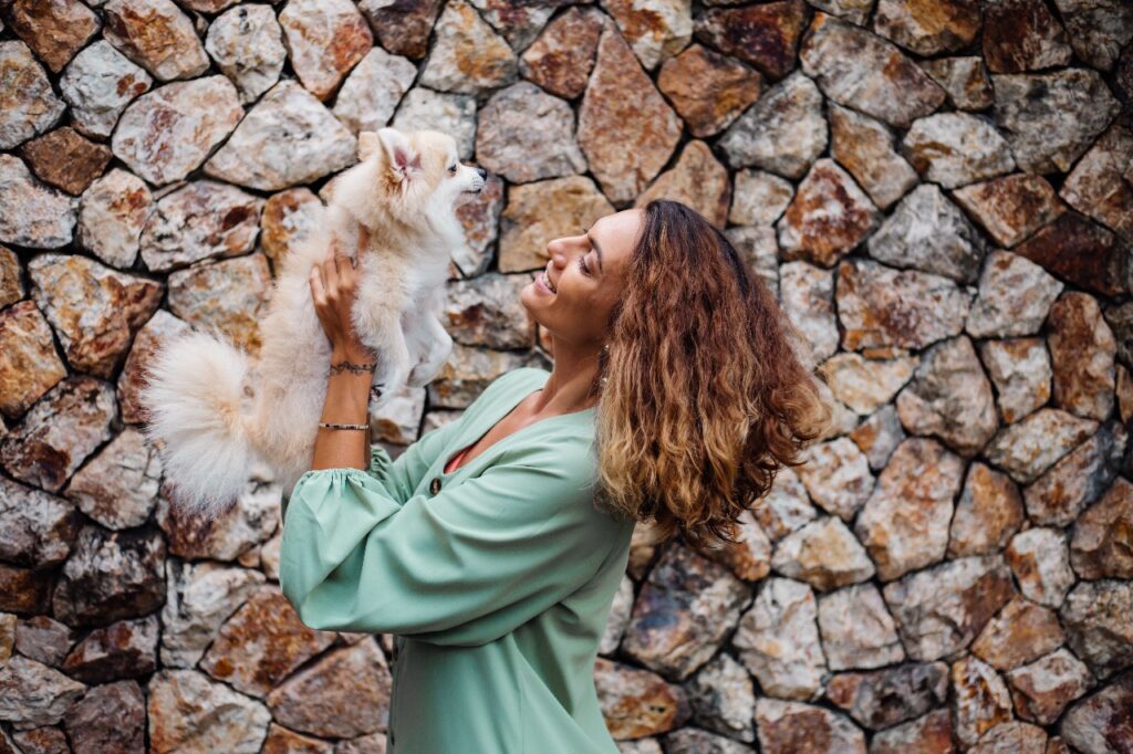 Pomeranian with woman