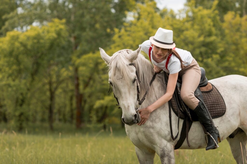 Woman riding horse countryside