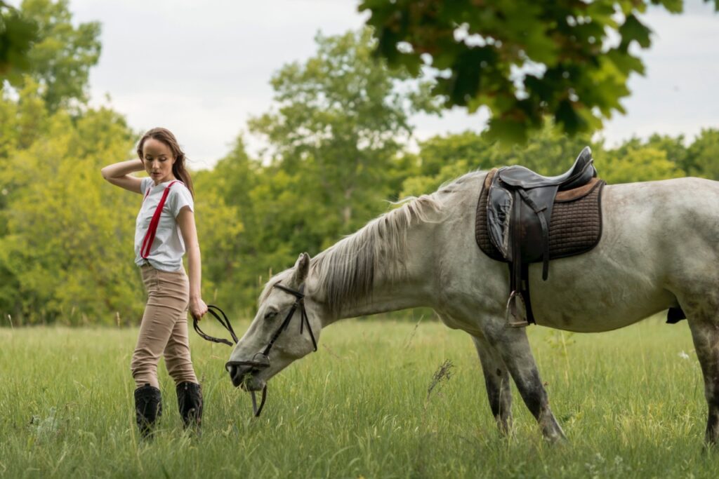 Horse following woman