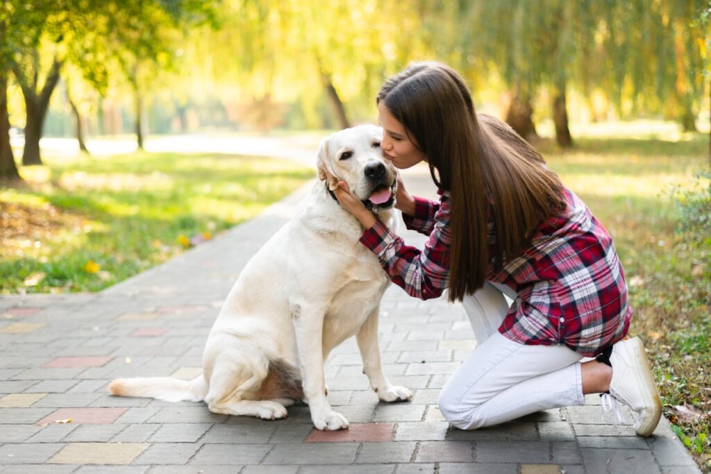 woman in loving her dog