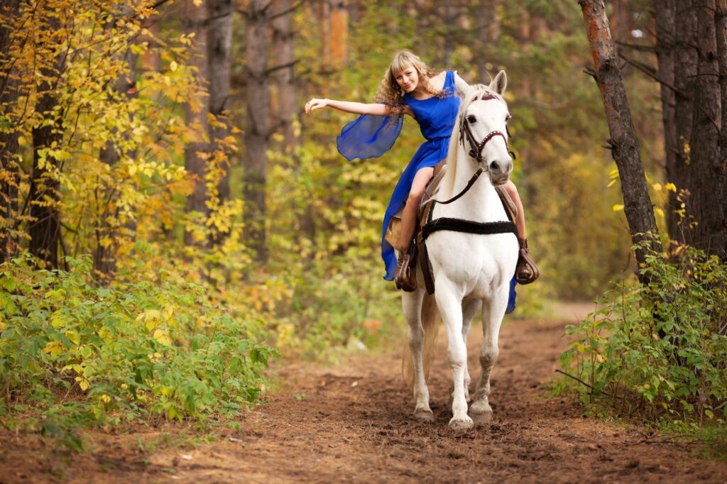 Happy girl Horse trail riding
