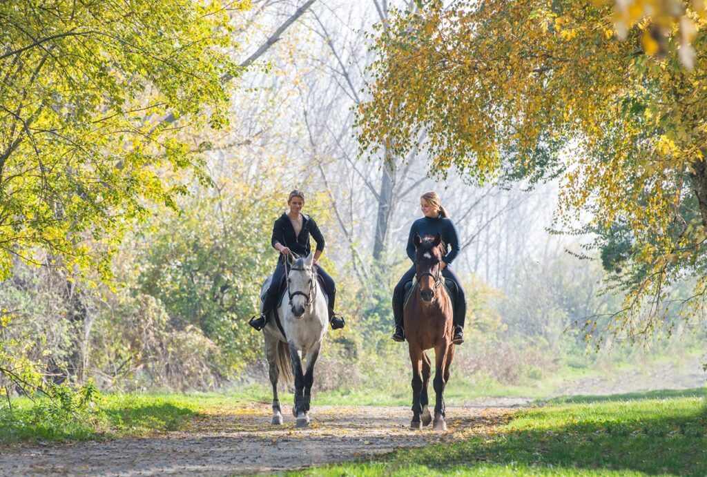 Girls riding a horse