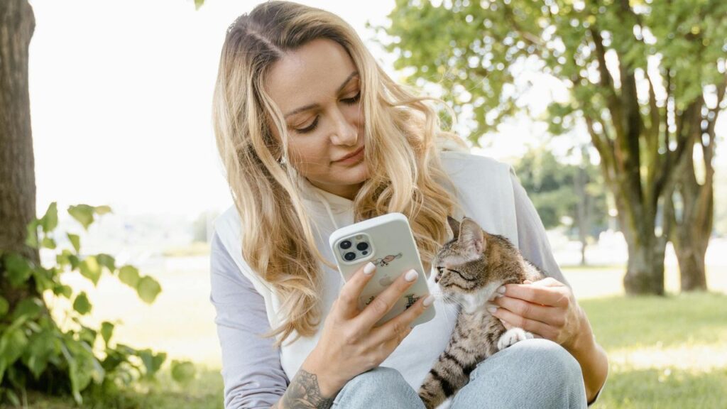 Woman sitting outside with cat