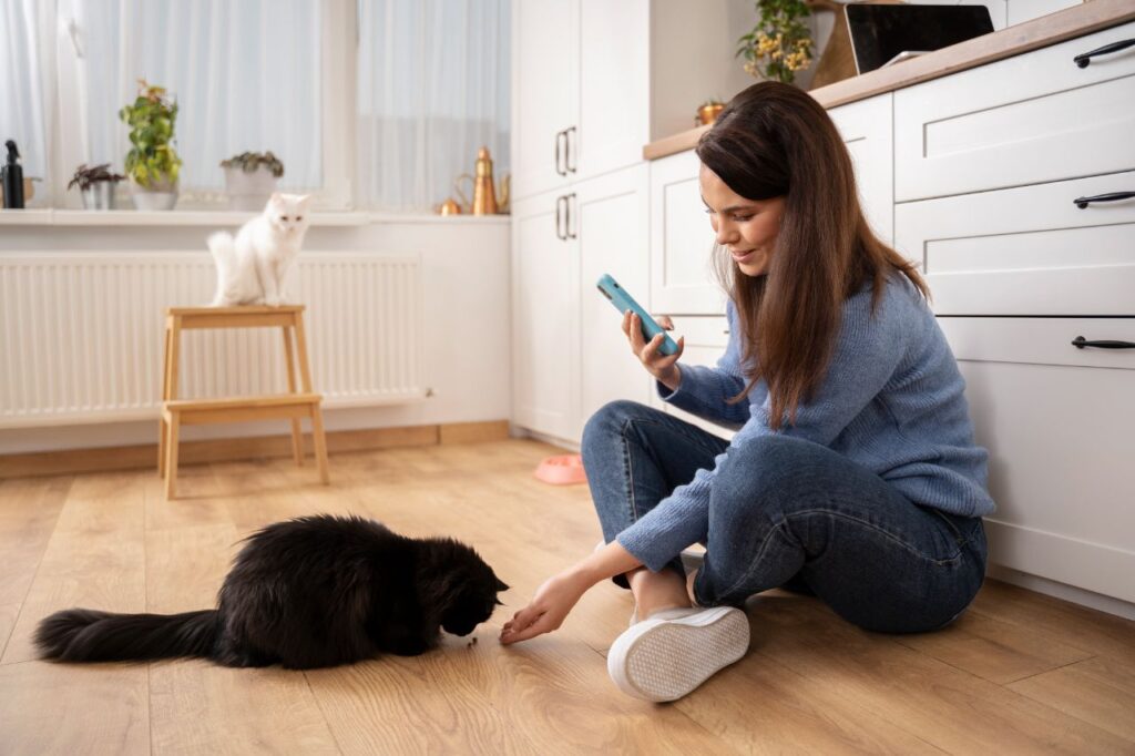 Woman using clicker for cat