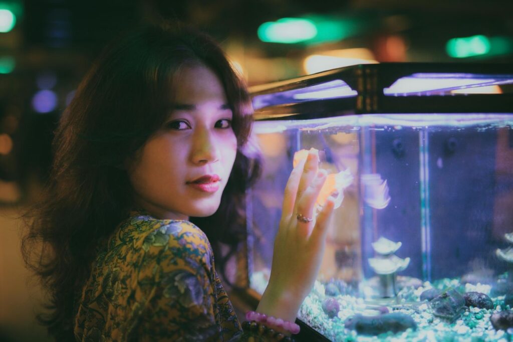 Woman with fish tank