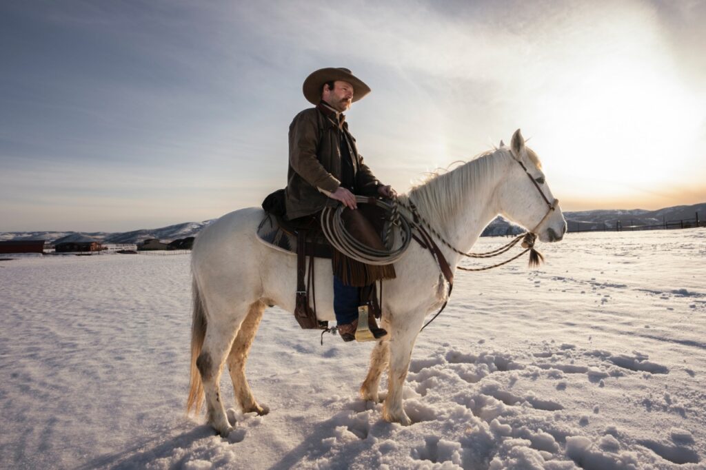 Cowboy riding horse
