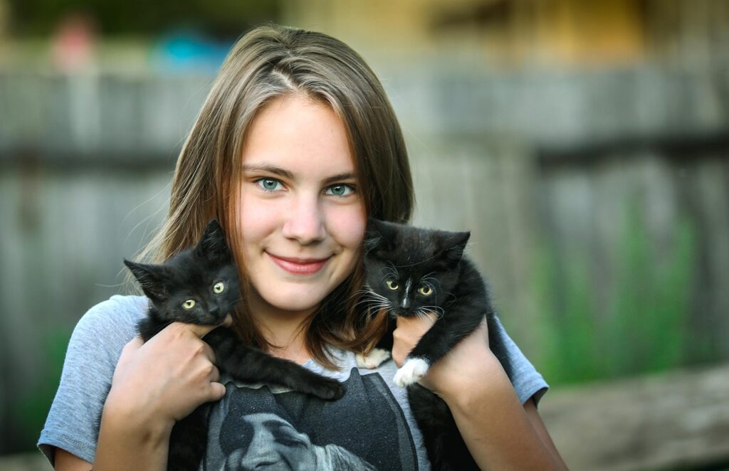 Woman hugging kittens