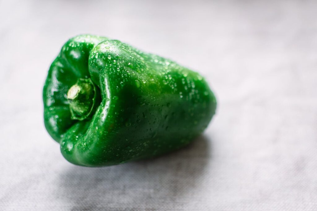 Bird eating bell peppers