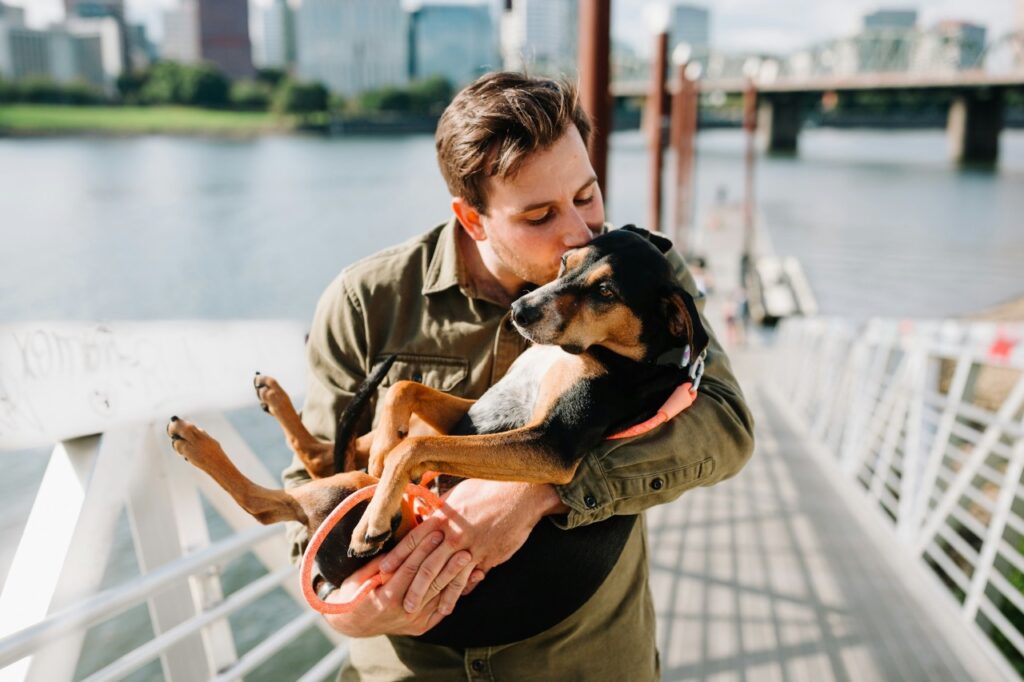 Man Holding a Dog