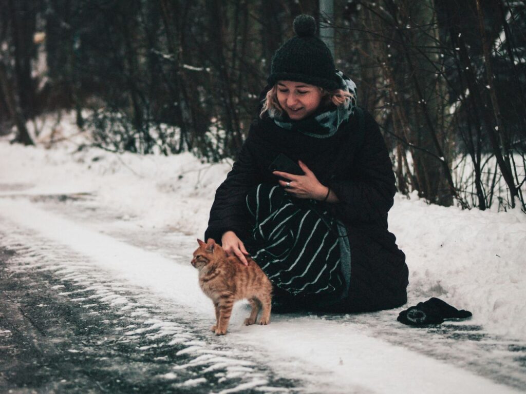 person with cat outdoors