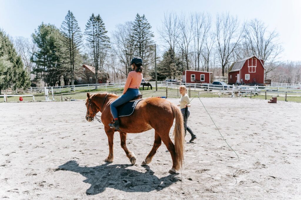 teen riding a horse