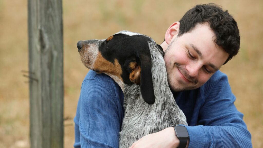 Man Hug Dogs