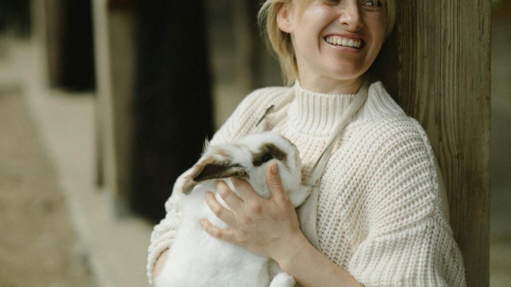 person bonding with rabbit