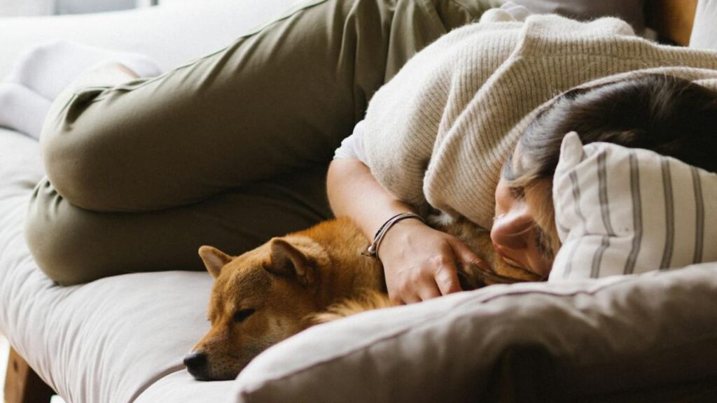 Women sleeping with dog