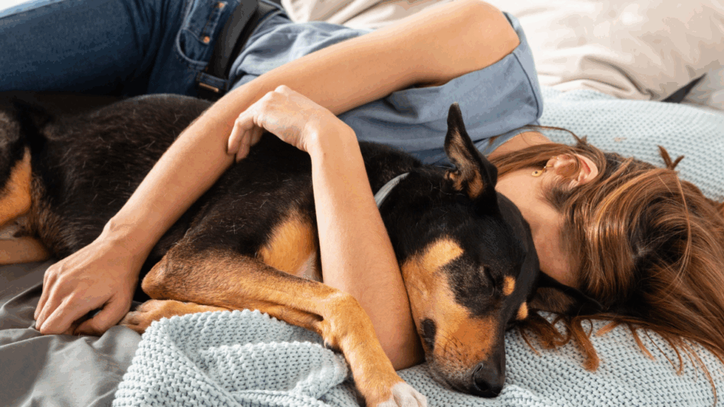 Women cuddling a dog